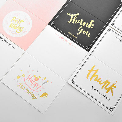 Le conseil en ivoire de l'anniversaire 250g de vacances a réutilisé l'impression faite sur commande de cartes de papier